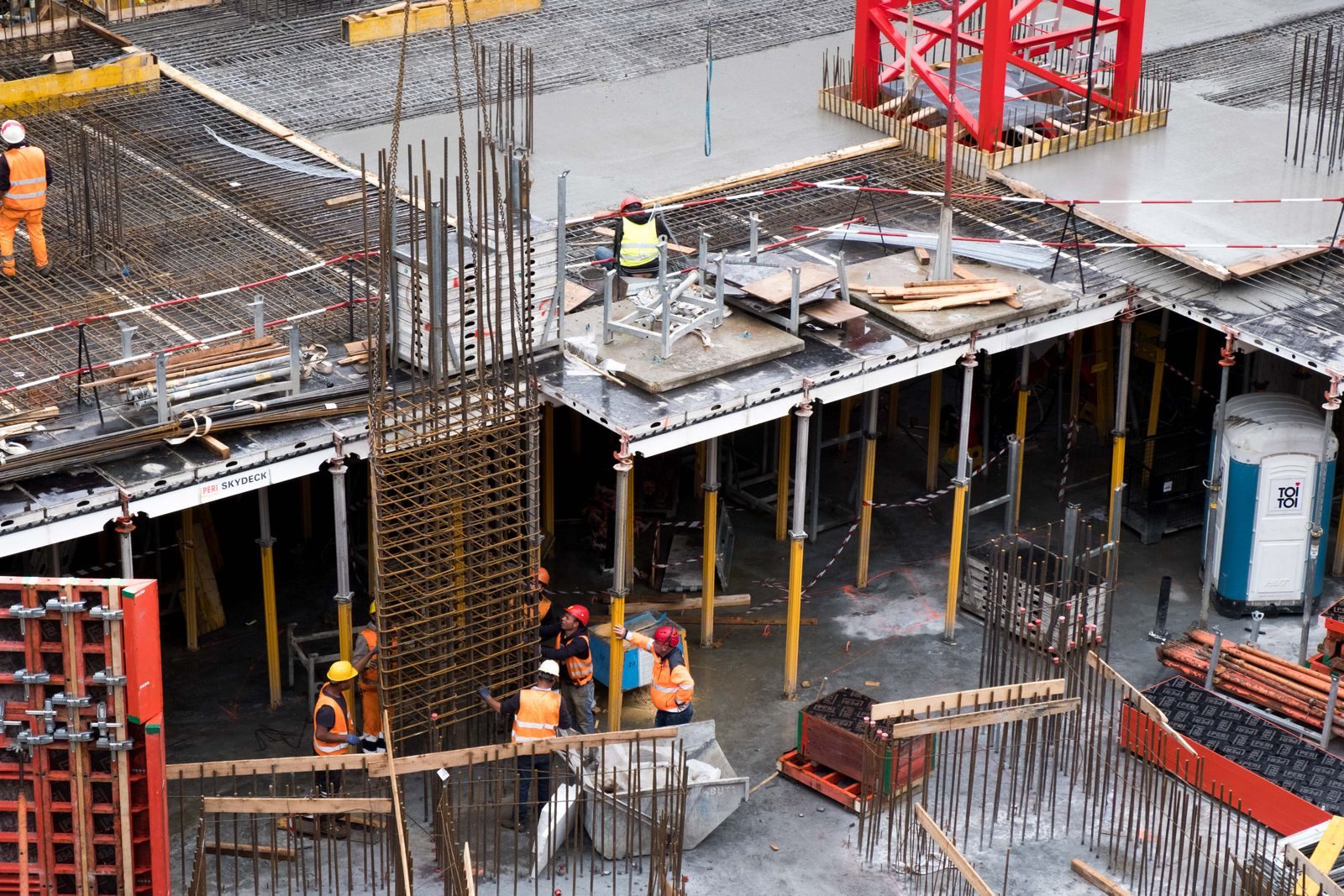 Construction workers erecting a steel frame photograph
