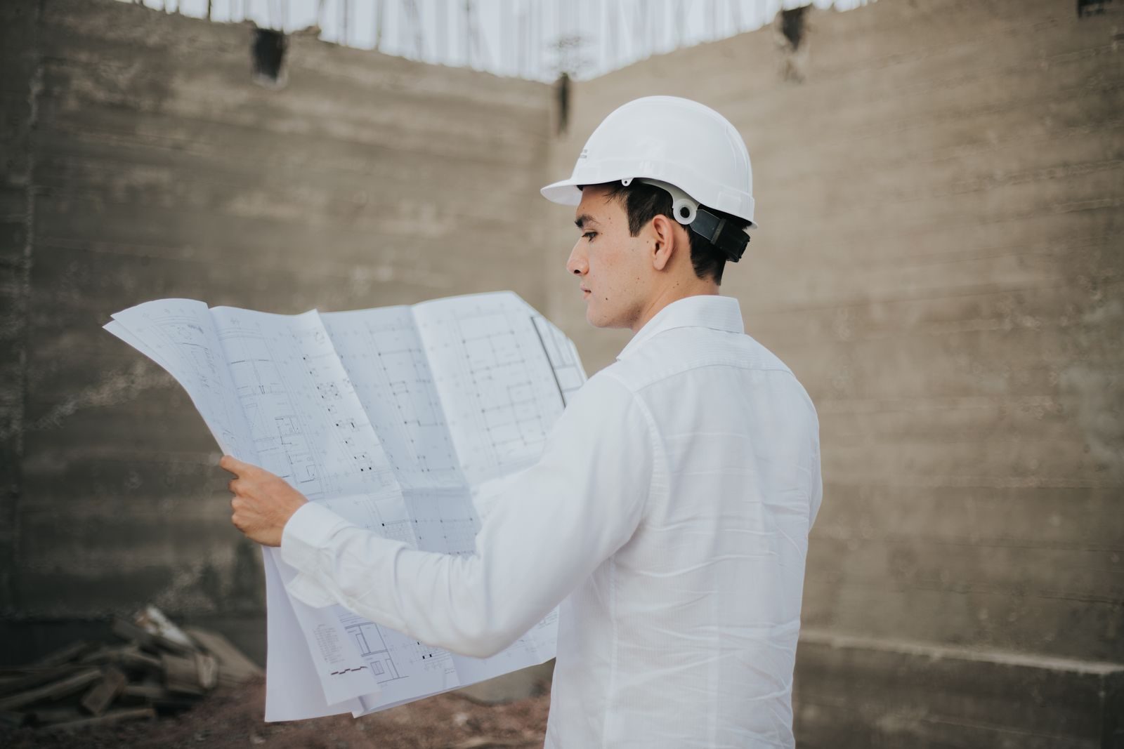 Architect examining building plans photograph